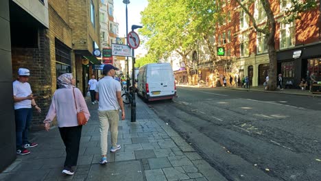 pedestrians and vehicles on a london street