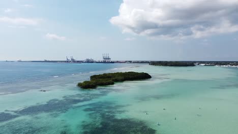 drone-captures-from-above-paradise-island-with-beautiful-islands,-sea-with-beautiful-blue-color,-boca-chica-dominican-republic,-dominican-republic