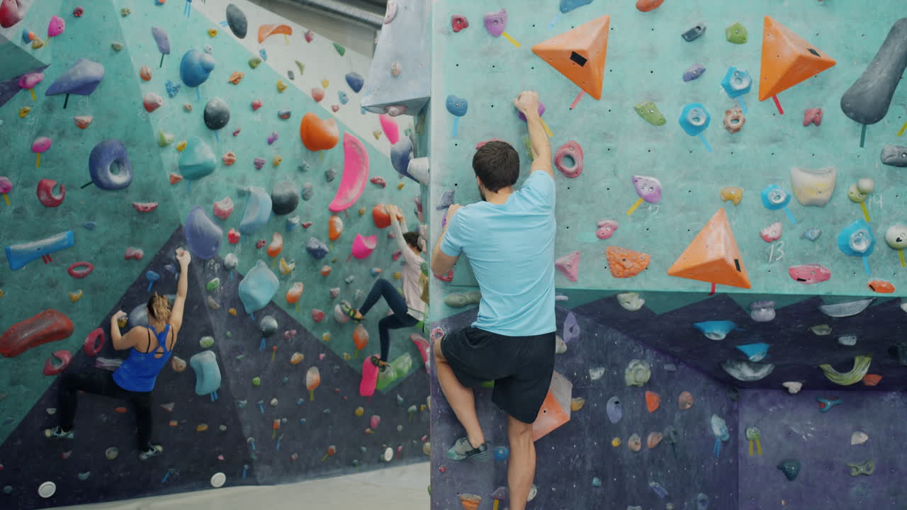 People rock climbing at an indoor gym
