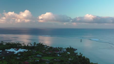 teahupoo tahiti new judge tower sunrise aerial drone view french polynesia coastline yellow clouds golden hour sunset wsl surfing summer olympic venue town upward motion