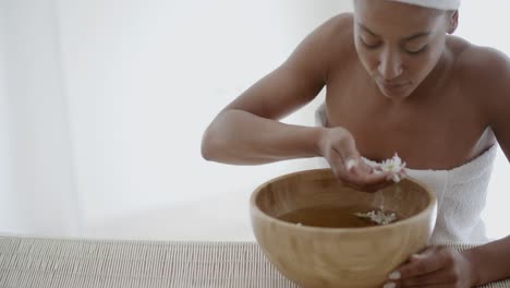 Young-Woman-Holding-Bowl-Of-Petals