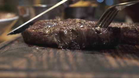 slicing a delicious steak