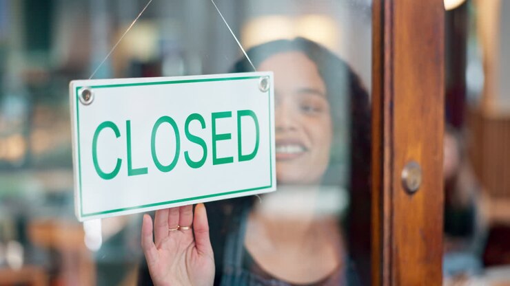 Door closed sign, happiness and restaurant woman
