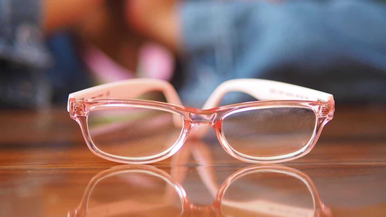 Wooden table with blurred person in background