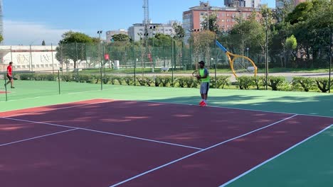 male tennis player hitting ball with a racquet during championship match