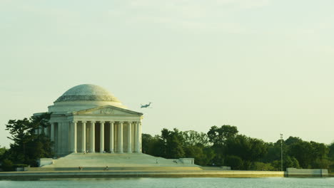 thomas jefferson memorial with an airplane in background.
