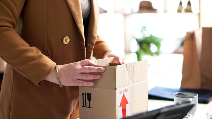 Woman, tablet and packing box in logistics