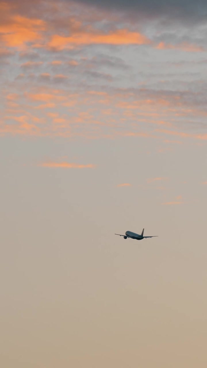 Airplane flying in the evening sky