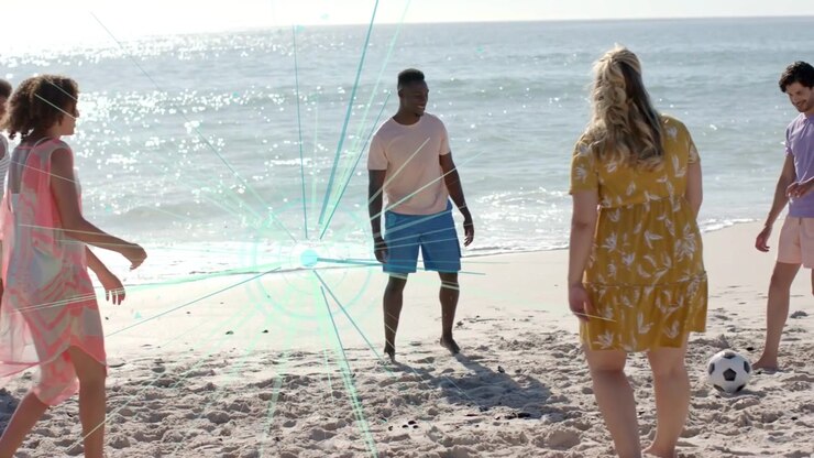 Woman in pink kicking ball, group trading passes for beach sports while teal overlay marking play