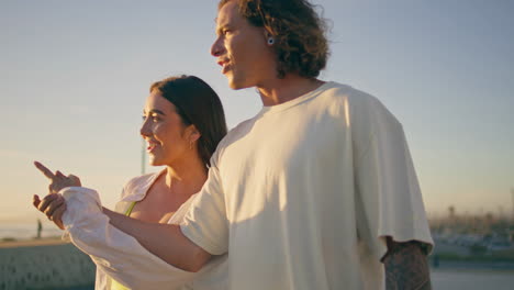 couple walking outdoors at sunset