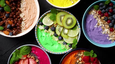 Various-healthy-fresh-smoothies-or-yogurts-in-bowls--With-strawberries--kiwi--chia--blackberries