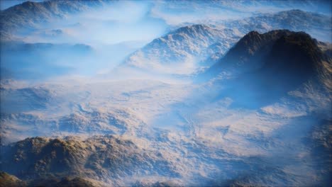 Distant-mountain-range-and-thin-layer-of-fog-on-the-valleys