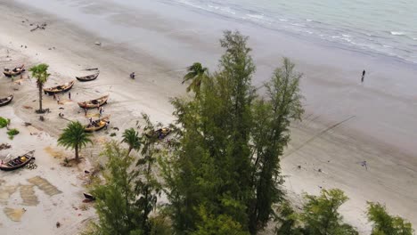 kuakata sea beach with fishing boats at the tropical shore in bangladesh