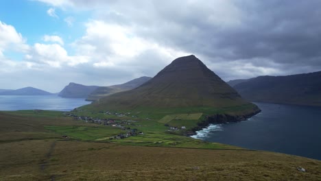 panning shot of faroe islands from bordoy to vidoy with malinsfajll mount standing out