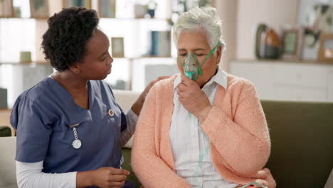 nurse assisting elderly woman with oxygen mask at home