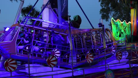 people enjoying a vibrant amusement ride