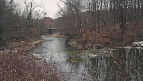 an old new england dam creates a waterfall