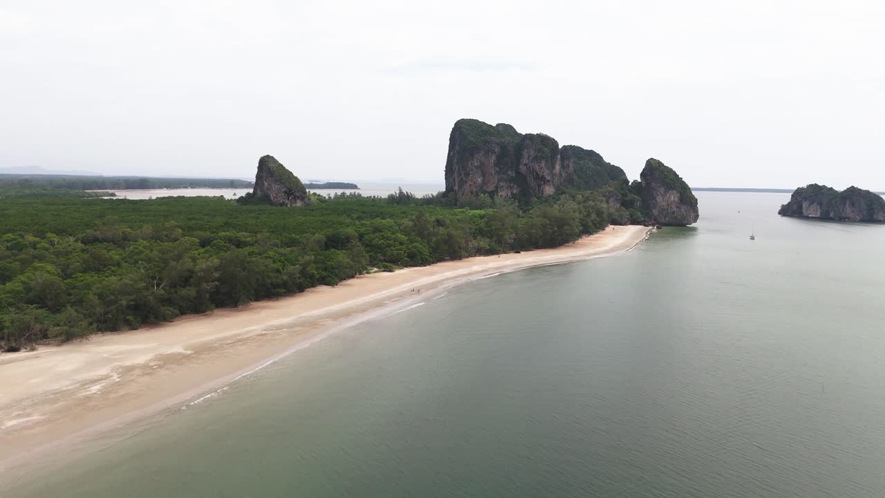 Aerial view of a tropical beach with islands and rock formations
