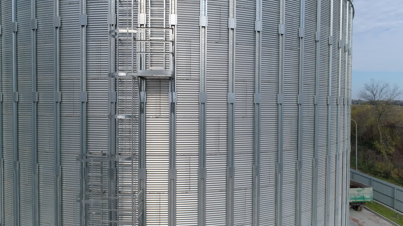 Metal grain industrial factory storage. Agricultural tank storehouse. Aerial view.