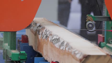 Work-of-the-sawmill-in-close-up.-Process-of-machining-logs-in-equipment-sawmill-machine-saw-saws-the-tree-trunk-on-the-plank-boards.