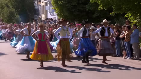 folk dance parade in traditional costumes
