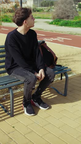 angry and stressed man on the park bench during the day