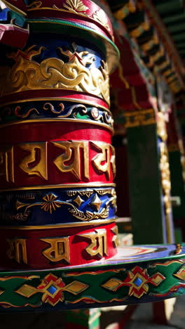 vibrant prayer wheels and monastery architecture