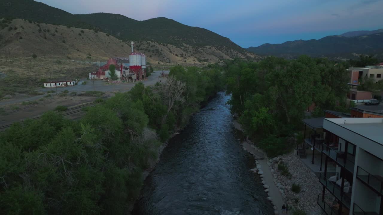 Aerial cinematic drone sunset dusk evening down river summer downtown Salida Colorado Buena Vista Arkansas River Riverside Park Scout surfing biking hiking rafting Rocky Mountain forward motion