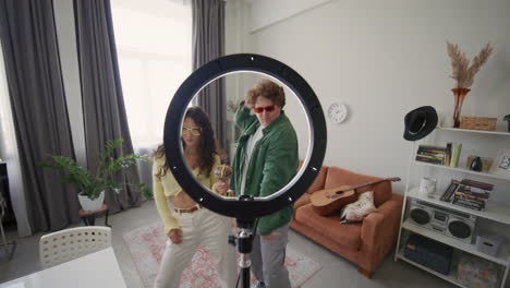young bloggers filming energetic dance video for social media platform