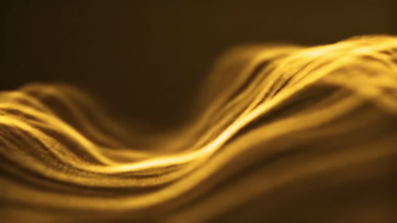 A mesmerizing display of golden waves undulating gracefully in soft light, creating intricate patterns that captivate the viewer’s attention during the evening.