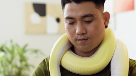 man with snake at home