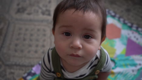 curious baby in living room hispanic biracial