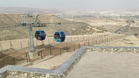 cable car of the aerial tramway connecting oufella peak and agadir city in morocco, overlooking a panoramic view of the beach-15