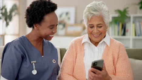 nurse assisting senior woman with smartphone