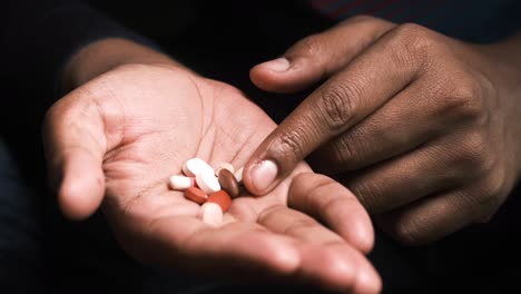 person holding pills