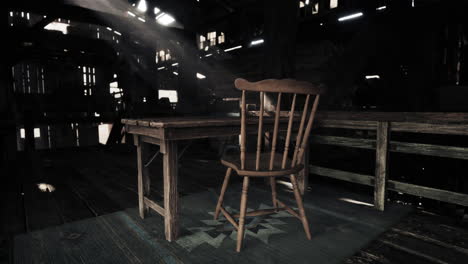 a rustic wooden chair and table in a barn