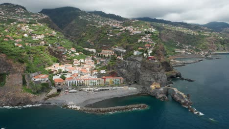 idyllic coastal landscape of madeira with steep cliffs and peaceful beach