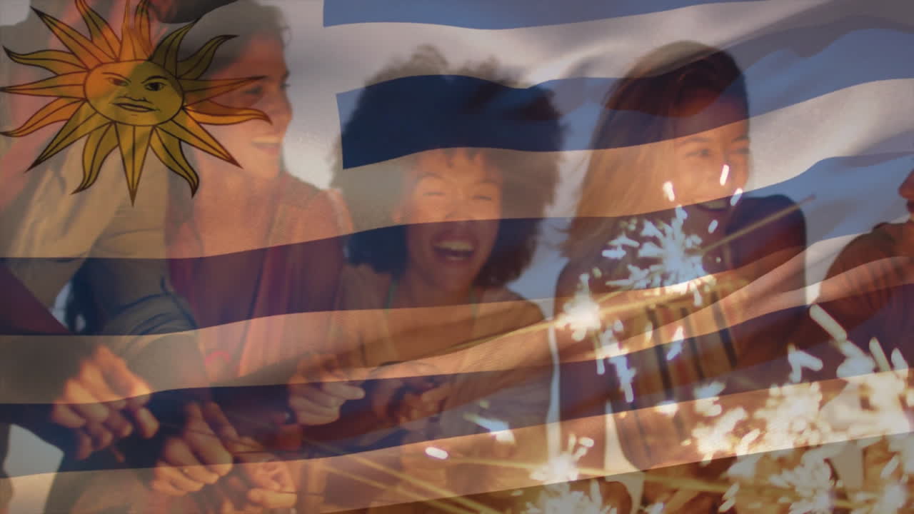 Celebrating with sparklers, people overlay Uruguay flag in animation background