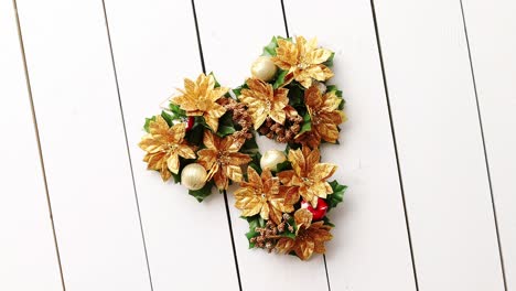 Christmas-Wreath-on-White-Wooden-Background