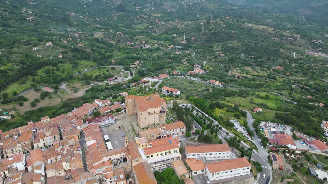 Aerial drone footage of Castelbuono, Sicily: medieval castle, historic village, mountain scenery and warm Mediterranean atmosphere. Ideal for travel and cultural stock footage