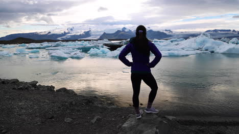 A-young-woman-stands-triumphantly-before-the-cold