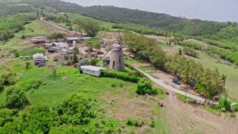 old windmill in rural countryside, aerial orbit