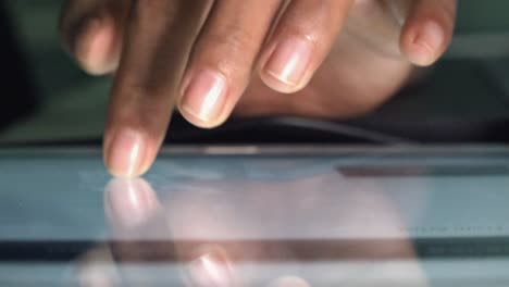 close shot of female hands using a tablet computer