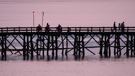 the mon bridge is an old wooden bridge located in sangkla, thailand