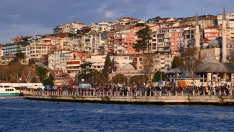 istanbul waterfront with people and mosques