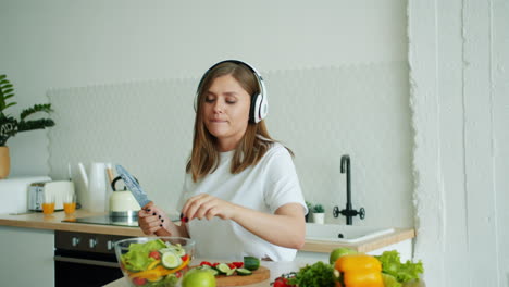 woman making a healthy salad in the kitchen