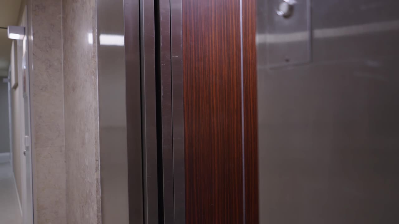 Young woman walking and standing in a modern office hallway