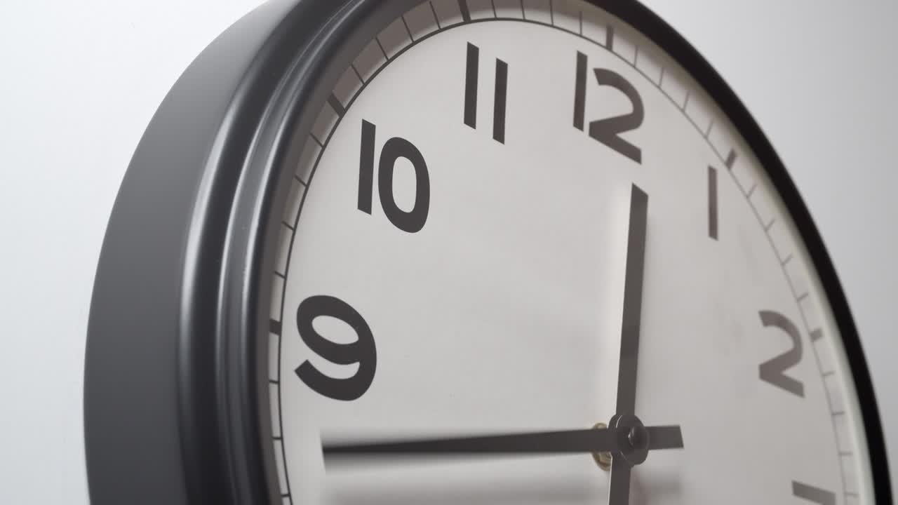Clock Face from 9 to 12 hours oclock on white wall in time lapse