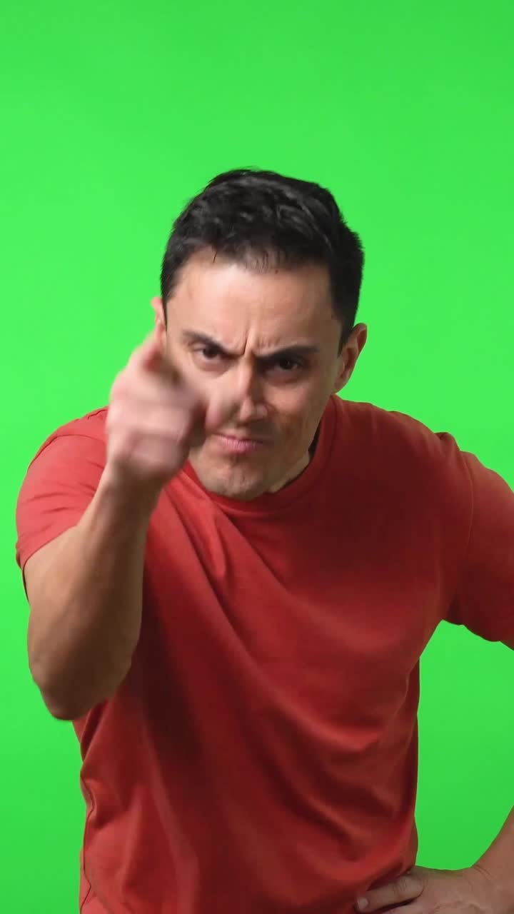 Man pointing on a green screen