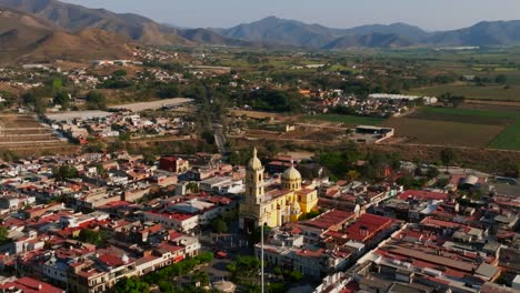 Scenic-aerial-orbit-view-of-Santuario-Diosesano-Church-and-the-rural-background-in-Tamazula-de-Gordiano